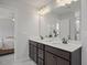 Bathroom showcasing a double vanity and bright lighting at 22 Van Winkle St, Lillington, NC 27546