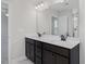 Double vanity bathroom with modern dark brown cabinets and white countertops at 22 Van Winkle St, Lillington, NC 27546