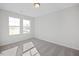 Spacious bedroom with two windows and carpet flooring at 22 Van Winkle St, Lillington, NC 27546