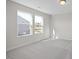 Bright and spacious bedroom with neutral carpeting and large windows at 22 Van Winkle St, Lillington, NC 27546