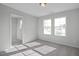Bright bedroom with two windows,walk-in closet and carpet flooring at 22 Van Winkle St, Lillington, NC 27546