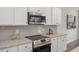 Well-equipped kitchen featuring stainless steel appliances, granite countertops, and stylish backsplash at 22 Van Winkle St, Lillington, NC 27546