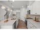 Modern kitchen with granite countertops, stainless steel appliances, and an island with a sink at 22 Van Winkle St, Lillington, NC 27546
