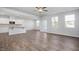 Open living room and kitchen area with hardwood floors at 22 Van Winkle St, Lillington, NC 27546