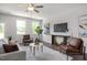 Bright and inviting living room with hardwood floors, contemporary decor, and lots of natural light at 22 Van Winkle St, Lillington, NC 27546