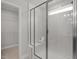 Shower with glass door and white subway tile at 22 Van Winkle St, Lillington, NC 27546