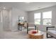Comfortable sitting room with large windows and stylish furniture at 22 Van Winkle St, Lillington, NC 27546