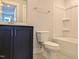 Bathroom boasts dark vanity, toilet, and a bathtub at 908 Allen Park Dr, Raleigh, NC 27604