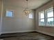 Bright dining room with hardwood floors and large windows at 908 Allen Park Dr, Raleigh, NC 27604