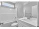 Clean bathroom offers a shower-tub combo and vanity with ample counter space at 208 Hillwood Dr, Sanford, NC 27332