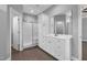 Beautiful bathroom featuring white cabinets, dual sinks, and walk-in shower at 208 Hillwood Dr, Sanford, NC 27332