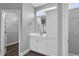 Beautiful bathroom featuring white cabinets, dual sinks, and walk-in closet access at 208 Hillwood Dr, Sanford, NC 27332