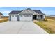 Charming single-story home boasting a two-car garage, well-manicured lawn, and inviting curb appeal at 208 Hillwood Dr, Sanford, NC 27332
