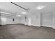 This garage is spacious and features overhead storage racks and hooks at 208 Hillwood Dr, Sanford, NC 27332