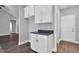 Pantry area with granite countertop and white cabinets at 208 Hillwood Dr, Sanford, NC 27332