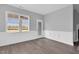 This cozy living space features wood-look flooring, detailed molding, and natural light at 208 Hillwood Dr, Sanford, NC 27332