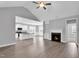 Spacious open-concept living area featuring vaulted ceilings, fireplace, and modern finishes at 208 Hillwood Dr, Sanford, NC 27332