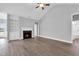 Open living room with fireplace, built-in shelving, and views of the outdoor space at 208 Hillwood Dr, Sanford, NC 27332