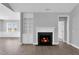 Bright and inviting living room with a cozy fireplace, built-in shelving, and wood floors at 208 Hillwood Dr, Sanford, NC 27332