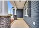 Covered porch featuring classic white columns, and a clear view to the outdoor scenery at 208 Hillwood Dr, Sanford, NC 27332