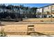 View of backyard with playground and townhomes in background at 3014 Freewinds Way # 45, Cary, NC 27519