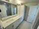 Bathroom with double vanity, large mirror and shower at 3014 Freewinds Way # 45, Cary, NC 27519