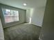 Bright bedroom with carpeted floor and large window at 3014 Freewinds Way # 45, Cary, NC 27519