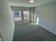 Bright bedroom with carpet flooring and two large windows at 3014 Freewinds Way # 45, Cary, NC 27519