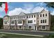 Three-story townhome building exterior with brick and siding at 3014 Freewinds Way # 45, Cary, NC 27519