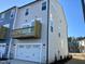 Exterior view of townhome with attached garage and deck at 3014 Freewinds Way # 45, Cary, NC 27519