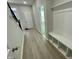 Foyer with luxury vinyl plank flooring and built-in storage at 3014 Freewinds Way # 45, Cary, NC 27519