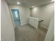 Upper hallway with carpet, leading to bedrooms at 3014 Freewinds Way # 45, Cary, NC 27519