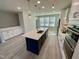 Modern kitchen with large island and breakfast bar at 3014 Freewinds Way # 45, Cary, NC 27519