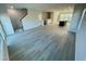 Open living room with hardwood floors and kitchen views at 3014 Freewinds Way # 45, Cary, NC 27519