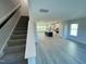 Open living room with stairs and kitchen view at 3014 Freewinds Way # 45, Cary, NC 27519
