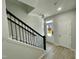 Modern staircase with black railing and light flooring at 3014 Freewinds Way # 45, Cary, NC 27519