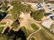 Scenic aerial view of the golf course community showcasing lush greenery and natural beauty at 556 Barbour Farm Ln, Four Oaks, NC 27524