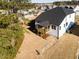Aerial view of the property, showcasing its landscaping, new construction, and community layout at 556 Barbour Farm Ln, Four Oaks, NC 27524