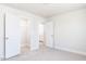 Bedroom featuring plush carpeting, and two entryways at 556 Barbour Farm Ln, Four Oaks, NC 27524