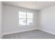 Simple bedroom with plush carpeting, a single window, and neutral walls at 556 Barbour Farm Ln, Four Oaks, NC 27524