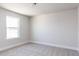 Cozy bedroom with neutral carpet and a bright window, creating a serene and comfortable space at 556 Barbour Farm Ln, Four Oaks, NC 27524