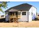 Back of home showcasing screened in porch and low-maintenance vinyl siding at 556 Barbour Farm Ln, Four Oaks, NC 27524