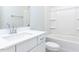 Pristine bathroom with white vanity, modern faucet, and shower-tub combination at 1142 Cottonsprings Dr, Wendell, NC 27591