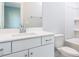 A bright bathroom with a white vanity, chrome fixtures, and a shower-tub combo at 1142 Cottonsprings Dr, Wendell, NC 27591