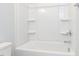The bathroom boasts a clean, white tub and shower combo with chrome fixtures at 1142 Cottonsprings Dr, Wendell, NC 27591