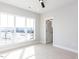 Light filled bedroom with a ceiling fan, plush carpet and large windows with neighborhood views at 1142 Cottonsprings Dr, Wendell, NC 27591