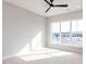 Bright, carpeted bedroom with large windows offering ample natural light and neighborhood views at 1142 Cottonsprings Dr, Wendell, NC 27591