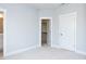 The bedroom showcases neutral walls, soft carpeting, and a walk-in closet at 1142 Cottonsprings Dr, Wendell, NC 27591