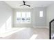 Sun-filled bedroom with large windows and light wood-style flooring at 1142 Cottonsprings Dr, Wendell, NC 27591