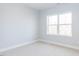 Bright bedroom features a large window and neutral carpeting and walls at 1142 Cottonsprings Dr, Wendell, NC 27591